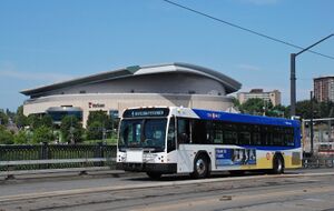 TriMet 2012 Gillig BRT bus with Rose Garden arena.jpg