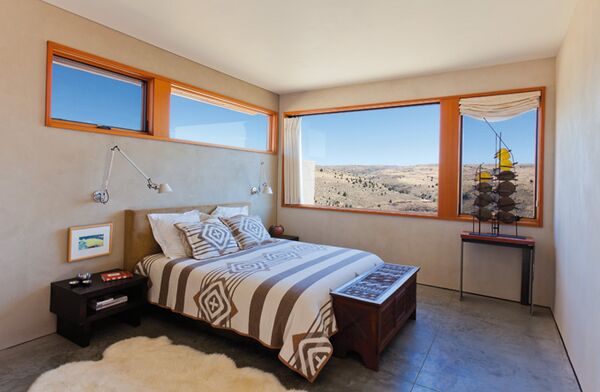 The combination of Pendleton bedding and spectacular views creates inviting sleeping spaces. The tabletop sculpture in the master suite was designed by Mary Ellen and fabricated by Forcum Steel and Design.
